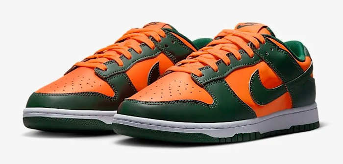 Side view of green and orange Nike Dunk shoes.